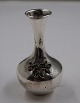 Nice and well maintained small plump vase decorated with four-leaved clover of 925 silver, in a ...