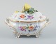 Nymphenburg, Germany, hand-painted porcelain lidded tureen with polychrome 
flowers, lid knob in the shape of a lemon.