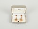 Wallins, Sweden.A pair of earrings in 14 carat gold adorned with cultured pearls.Dated ...