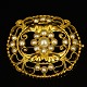 Georg Jensen; A brooch of 18k gold set with pearls