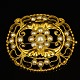 Georg Jensen 
gold jewellery.
Georg Jensen; 
A big oval 
brooch made of 
18k gold set 
with pearls. 
...