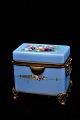 Antique sugar box in opaline glass painted in blue with fine floral motifs and bronze mounting. ...