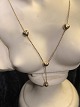 14 k Gold 
Necklace with 
four hearts on 
L .42 cm