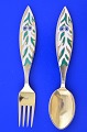 Anton Michelsen Christmas cutlery,  gilded sterling silver with an inlaid enamel motif. ...