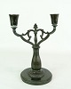 Candlestick by 
Just Andersen, 
2 arms in disco 
metal with fine 
decoration, as 
well as the 
stem. ...