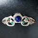 Small Art 
Nouveau brooch 
in silver with 
blue stones and 
smaller red and 
green ones from 
Mogens ...