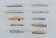 A collection of ten Danish tie pins in sterling silver and gold-plated metal.