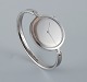 Vivianna Torun Bülow-Hübe, steel wristwatch.
Design 227. Mechanical movement with manual winding.
Silver colored dial with steel hands.