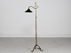 Antique brass floor lampFloor lamp made in the 1920s with adjustable shadeThe shade is ...