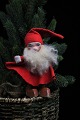 Gammel 
julenisse med 
skæg , filt tøj 
og ansigt og 
træsko i 
bemalet ler.
Højde: 14cm.