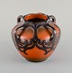 Ipsens enke, Danmark. Art nouveau vase i håndmalet glaseret keramik. Modelnummer 
710. 

