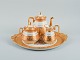 Le Tallec, 
France. Tea 
service on a 
large tray 
consisting of 
coffee pot, 
sugar bowl and 
creamer ...