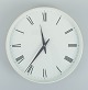 Henning Koppel for Georg Jensen. White plastic wall clock. Dial with Roman 
numerals. Clockwork quartz. 1960 / 70