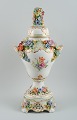 Dresden, 
Germany. 
Colossal lidded 
 porcelain vase 
on stand.
Lavishly 
decorated with 
flowers in ...