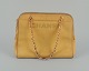 Chanel calfskin 
bag in yellow 
Italian 
calfskin.
1970/80s.
Made in Italy.
Dust bag ...