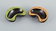 Vallauris, 
France, two 
ceramic bowls 
with yellow and 
green glazes on 
a black ...