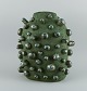 Christina Muff, dansk samtidskeramiker (f. 1971).
Large unique spiked stoneware vessel. This piece is covered in a green, matte 
glaze but breaks into a shiny grey/green on the spikes.