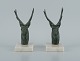 A pair of French Art Deco bookends. Stags in patinated metal on a marble base.
