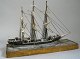 Model ship in wood, three-masted, Denmark, 19th century. On wooden foot with grained paintings ...