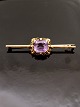 14 carat gold 
brooch L. 6.5 
cm. with 
tourmaline item 
no. 522818