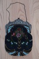 Handmade bag, made of glass beads
This beautiful old handmade bag, from about 1880, 
is handmade of glass beads with embroidery which 
shows creative figures
The shape is with a beautiful closing at the top 
made of metal which is silver-plated