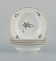 Royal 
Copenhagen 
Saxon Flower. 
Five deep 
plates in 
hand-painted 
porcelain with 
flowers and 
gold ...