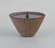 Arne Bang. 
Ceramic vase 
with lid in 
patinated 
brass.
Signed AB 119.
Beautiful 
glaze in shades 
...