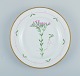 Royal Copenhagen, Flora Danica style. Dinner plate hand painted with floral 
motif and gold decoration.