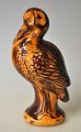 Saving bank in 
the shape of a 
standing stork, 
Rønne, 
Bornholm, 19th 
century. 
Denmark. Yellow 
and ...