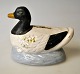 Saving bank in 
the shape of a 
duck, 19th 
century 
Denmark. 
Earthenware - 
cold painted 
with white, ...