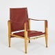 Kaare Klint. 
Safari chair 
with ash wood 
frame. Seat, 
back, armrests 
and 
button-stitched 
cushion ...