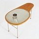 Finn Juhl 
"Ross" teak 
coffee table on 
slender steel 
frame with 
kidney-shaped 
table top 
inlaid ...