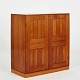 Mogens Koch cabinet of solid Oregon pine on plinth. Front with two doors. Brass nail hole ...