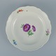 Meissen, Germany, large round serving dish.
Hand painted with floral motifs in different colours.