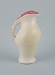 Pol Chambost 
(1906-1983) in 
style of, 
ceramic jug in 
matt white 
glaze.
Interior 
decorated in 
...