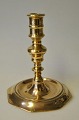 N&aelig;stved 
brass baroque 
candlestick, 
18th centur,y 
Denmark. 
Octagonal foot. 
H.: 15.2 cm. 
...