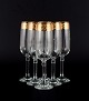 Italian design, six Champagne glasses in clear art glass with gold rim.Approx. 1960s/70s.In ...