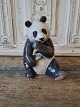 Royal 
Copenhagen 
figurine, panda 
eating bamboo 
No. 662, 
Factory first
Height 18 cm. 
Design: ...