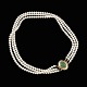 Knud V. 
Andersen. 
Three-Strand 
Pearl Necklace 
with 14k Gold 
Lock with Jade.
Designed and 
...