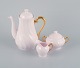 Tuscan, England, coffee service in pink porcelain with gold decoration 
consisting of coffee pot, creamer and sugar bowl.