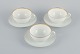 Rosenthal, Germany, a set of three large teacups and matching porcelain saucers. 
Thin white porcelain with gold decoration.
