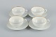 Rosenthal, Germany, a set of four large teacups and matching porcelain saucers. 
Thin white porcelain with gold decoration.