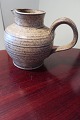 An old jug potteryFrom Kähler, DenmarkH: about 19cmIn a good conditionWe have a large ...
