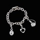 Georg Jensen. 
Sterling Silver 
Bracelet #144 
with Charms - 
Henning Koppel.
Three Charms: 
Heart, ...