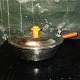 Casserole in 
silver plate 
with lid. Knob 
and handle in 
light brown 
bakelite. Minor 
engraved ...