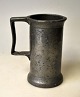 Pewter 
measuring mug, 
19th century 
Denmark. With 
adjustment 
stamps. 
Stamped.: BPH. 
H: 10.8 cm.
