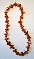 Rarely designed 
amber chain 
with round and 
crescent 
pieces, 20th 
century 
Denmark. 
Length: 53 ...