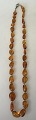 Amber chain, 
polished 
pieces, 20th 
century. 
Denmark. 
Length: 54 cm.
Really nice 
chain.