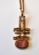 Finnish bronze 
pendant with 
chain, 20th 
century. 
Pendant 
decorated with 
red stone. 
Stamped: Made 
...