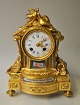 French ormelue bronze mantel clock, 19th century. Case decorated with musical instruments, ...
